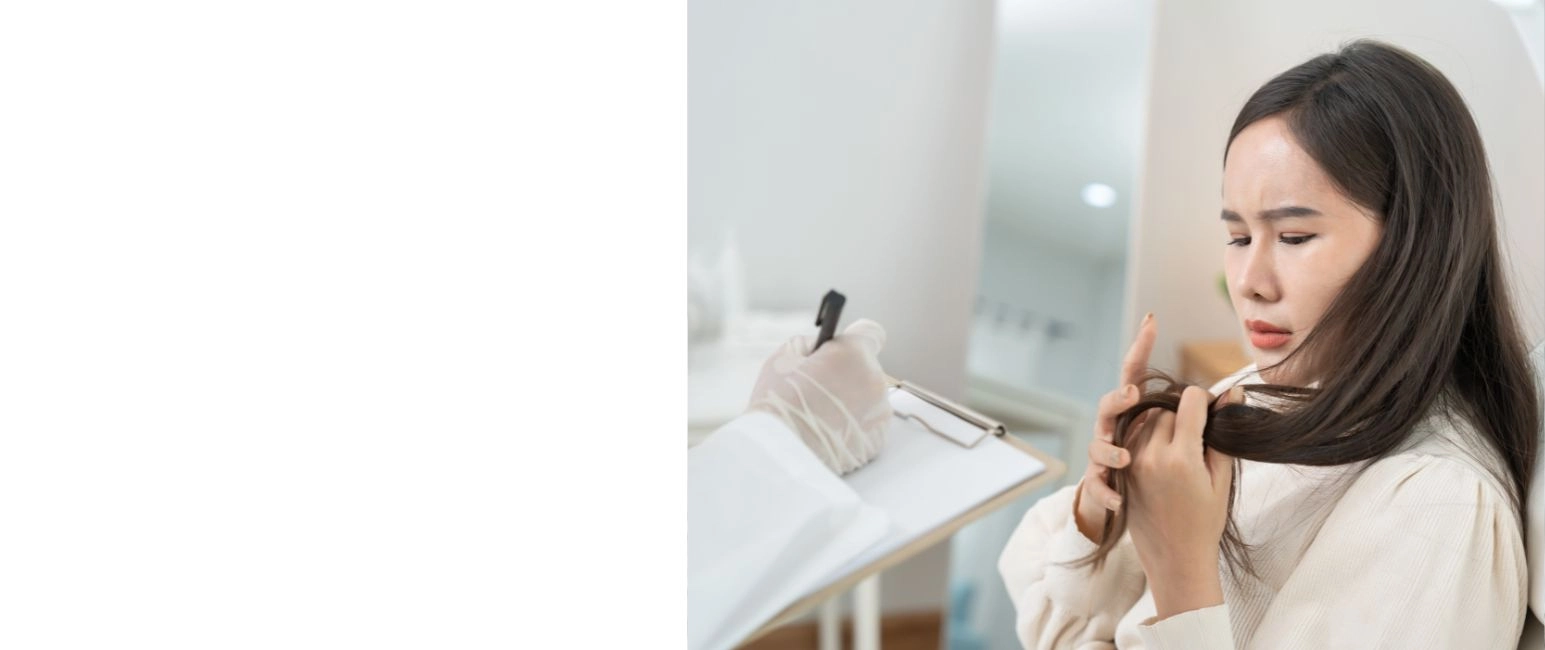 Woman concerned about hair fall during consultation with doctor
