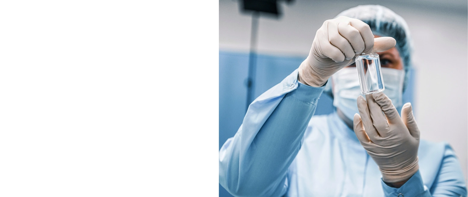 Medical professional holding vial in laboratory setting