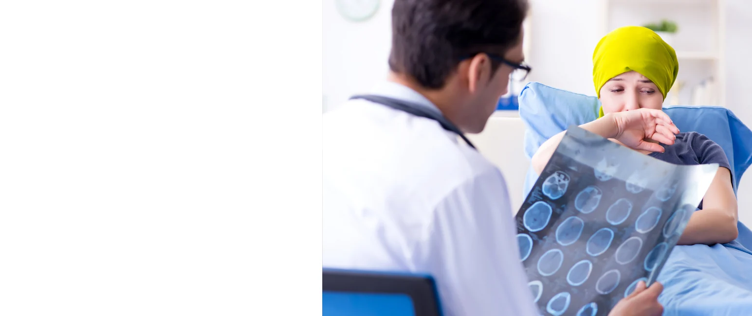 Doctor reviewing medical scan with cancer patient during consultation