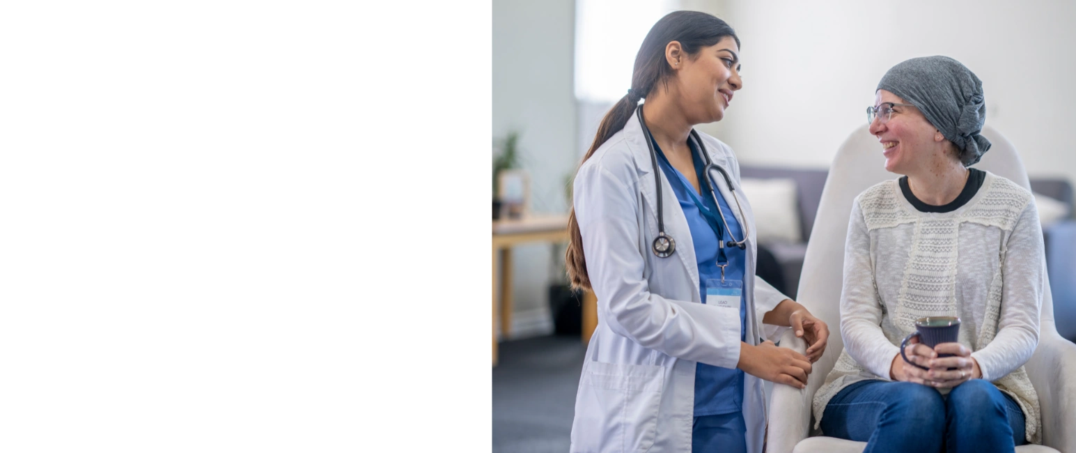 Doctor comforting cancer patient during consultation