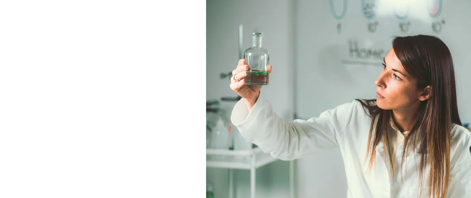 Homeopathic medicine preparation in laboratory examining liquid tincture