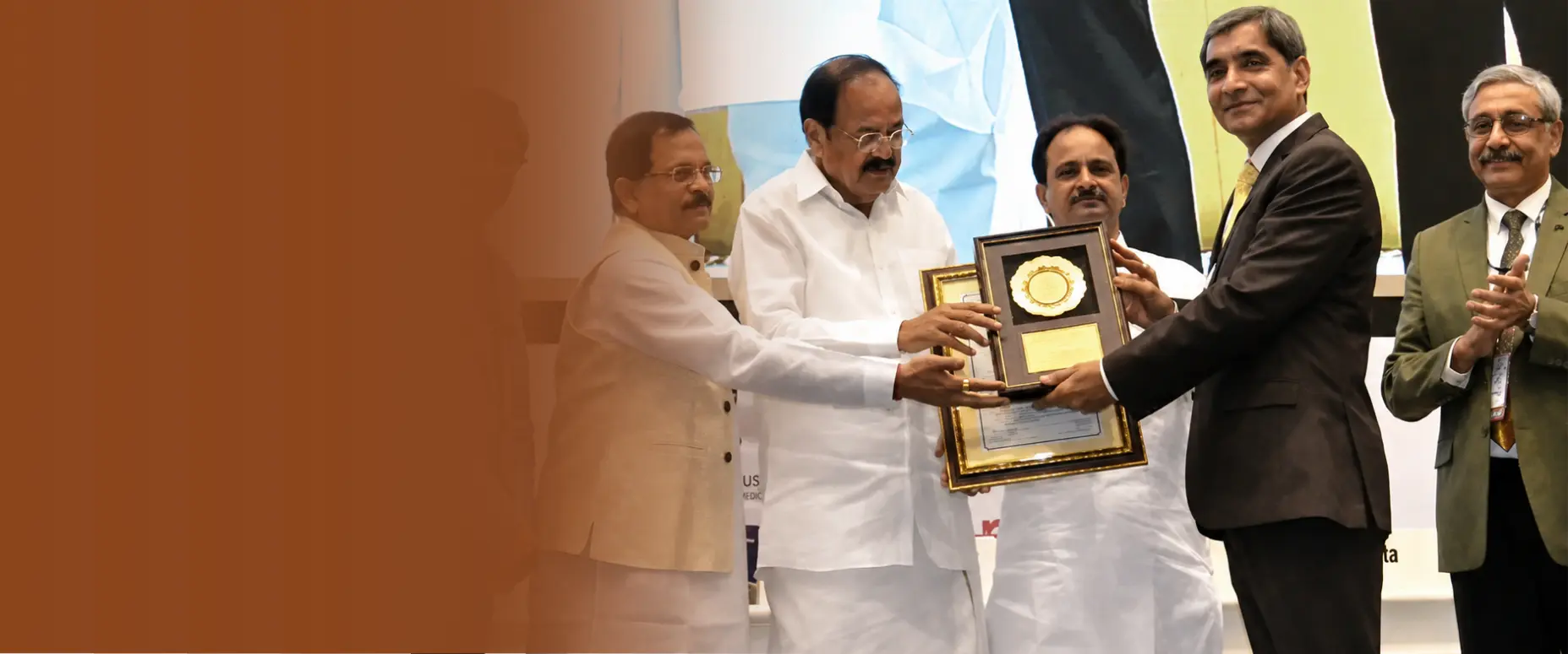 Dr. Rajesh Shah receiving a National Award from the Government of India for his contribution to homeopathy.